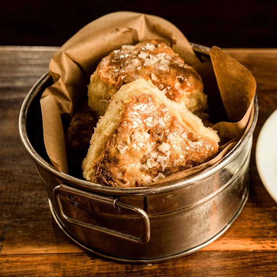 Freshly baked Southern biscuits in a rustic tin